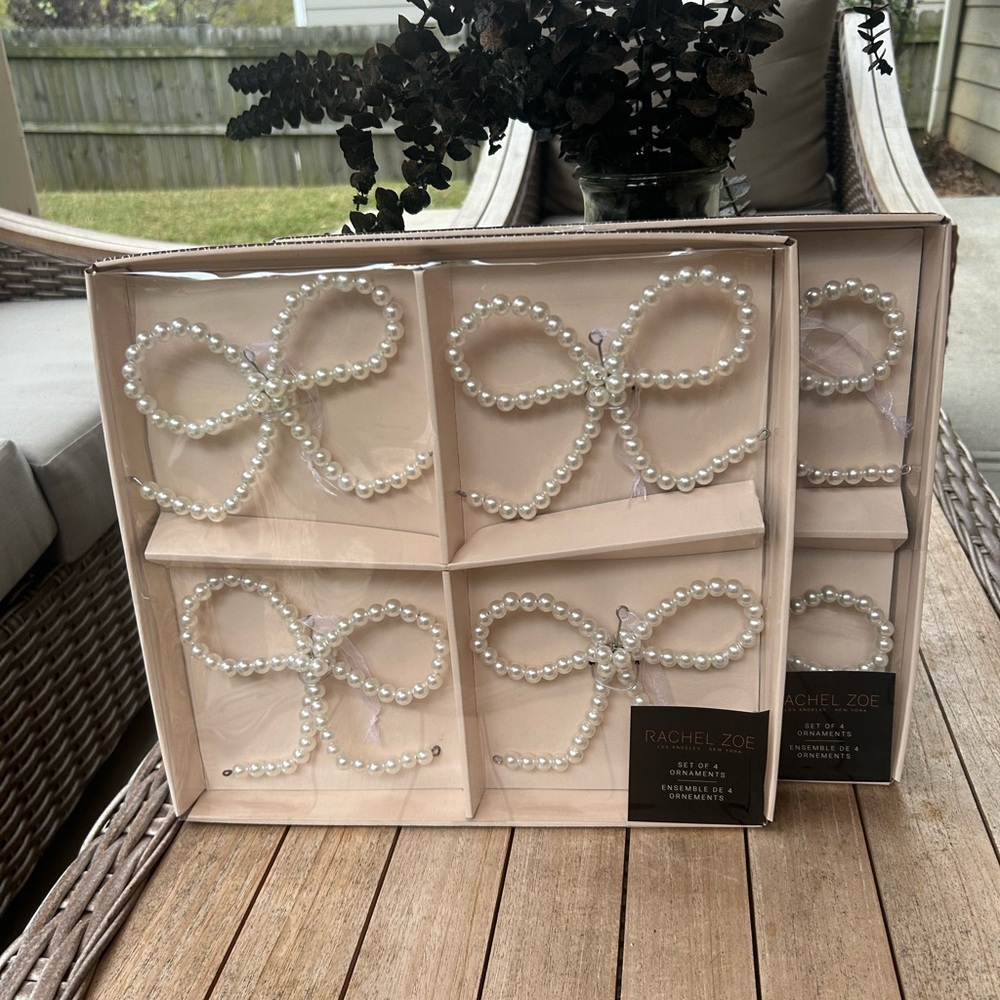 Two set of four pearl bow ornaments